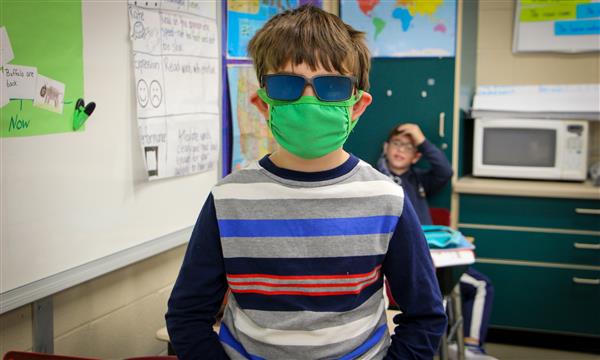 A boy is dressed as a book character